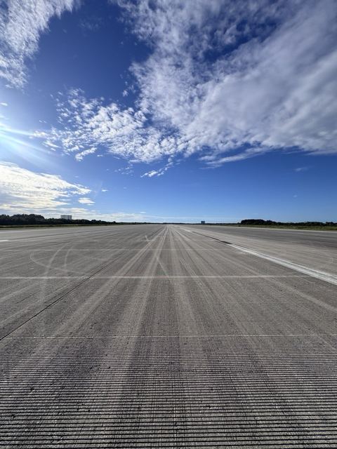 Tyre marks down the empty runway.